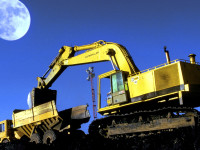 A full moonrise over coal loading at mine.