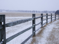 Fence at the Kansas Governor’s Mansion is covered with early winter snow.